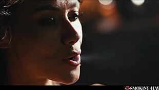 veronica leal smokes cigarette seductively while stroking throbbing cock in fetish scene