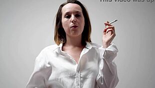 Wanna watch this playful housewife brunette smoke hot in bra and blouse?