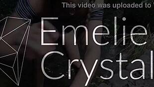 emelie crystal releases golden shower in wild outdoor nature setting.