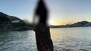 African beauty bares wet pussy outdoors on public beach during steamy massage and oral tease