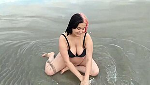 pregnant teen belle seduces beach crowd with her fetish belly
