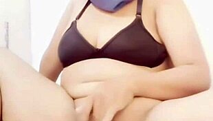 brunette bimbo fists hairy gaping pussy lips with thick cucumber