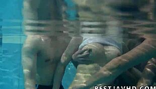 Japanese Tramp Sloppily Services Two Hunks' Cocks in Uncensored JAV Group