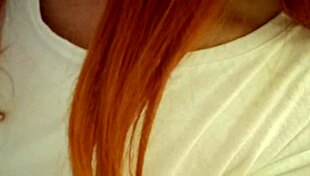 Redhead teen 18+ relaxes tattooed in steamy bath
