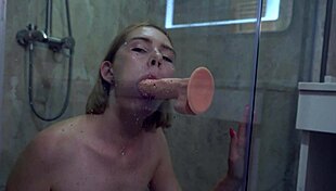 hey babe, watch her suck that dildo deep then fuck shaved pussy to shower orgasm!
