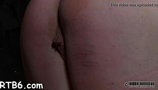 Tied slave endures master's brutal punishment session