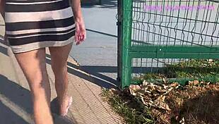 Skinny old wife flashes miniskirt ass in crowded public park