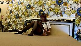 skinny redhead braless in stockings ignores boredom fingering tight shaved pussy on bed