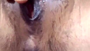 indonesian beauty fingers her swollen lips gently