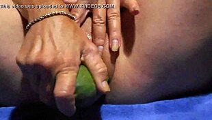 WOW, WATCH HER GAPING PUSSY DEVOUR THAT CUCUMBER!