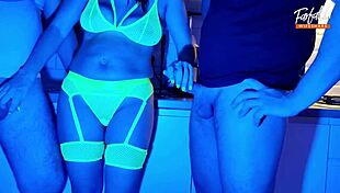 Neon lights glow as wife sucks two cocks in wild threesome