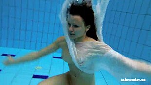 kristy the brunette babe flaunts big boobs underwater in pool