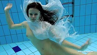 kristy the brunette babe flaunts big boobs underwater in pool