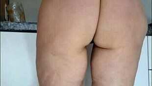hidden cam catches stepmom's sheer panty tease in kitchen