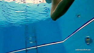 kristy the brunette babe flaunts big boobs underwater in pool