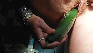 Granny fucks hairy pussy with cucumber
