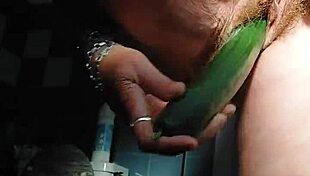 Granny fucks hairy pussy with cucumber
