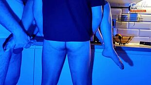Neon lights glow as wife sucks two cocks in wild threesome