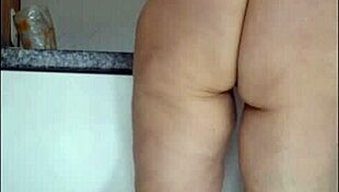 hidden cam catches stepmom's sheer panty tease in kitchen