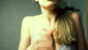 a beauty with red lips jerks off her boyfriend close-up pov