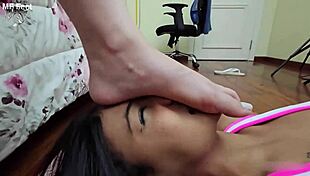 Brazilian brunette lesbian stomps bare feet on face in bedroom domination