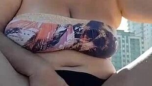 imagine this mature african milf with big pussy lips peeing right on the beach