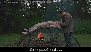 Skinny slave bound outdoors takes master's cock and spanking exploitation