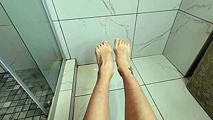 hey check this sexy milf teasing my cock with her bare feet and toes in shower