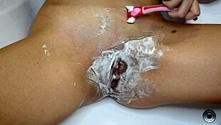 POV Close Up Shaving Her Unshaven Pussy in Bathroom