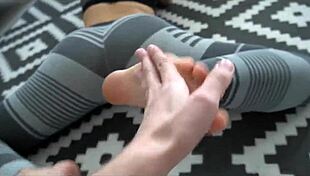 yoga workout babe with perfect tattooed body gives pov footjob