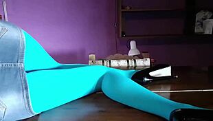 Milf's beautiful legs shine in pantyhose and heels on table