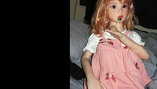Camille sex doll strikes hot poses in tight pink outfit