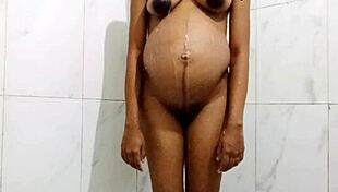 Pregnant stepmom craves anal dildo play while bathing