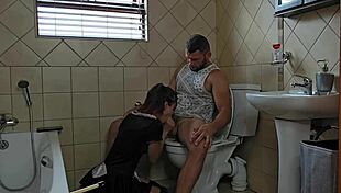 petite slut kneels on toilet desperately sucking throbbing cock for cum