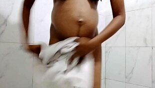 Pregnant stepmom craves anal dildo play while bathing