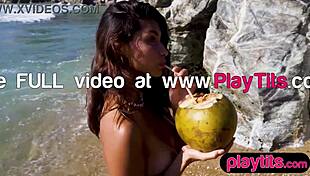 Watch this petite Latina strip at the beach showing off her big wet ass