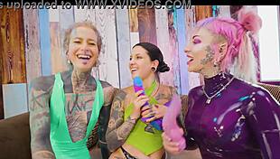 Goth babe toyed and gangbanged by dommes till she squirts wildly