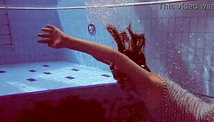 sexy petite russian teen pornstar libuse flaunts small tits at beach pool underwater with boyfriend