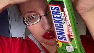 Giantess with big lips eats snickers bar