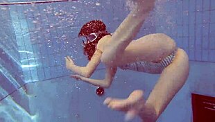 sexy petite russian teen pornstar libuse flaunts small tits at beach pool underwater with boyfriend