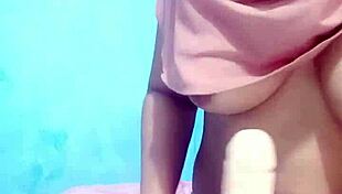 Indonesian hijab girl masturbates with dildo