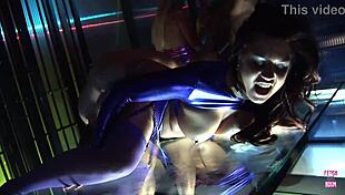 brunette bdsm master unleashes on two bound slaves fucking her while blondes watch from cages in heels