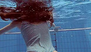sexy petite russian teen pornstar libuse flaunts small tits at beach pool underwater with boyfriend