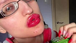 Giantess with big lips eats snickers bar