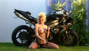 blonde bombshell caylian curtis fingers herself in fishnets as a bikers dream