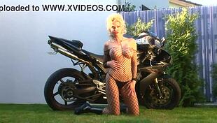 blonde bombshell caylian curtis fingers herself in fishnets as a bikers dream