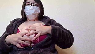 a married woman masturbates while rubbing her breasts