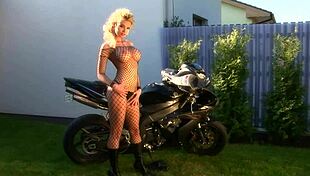 blonde bombshell caylian curtis fingers herself in fishnets as a bikers dream