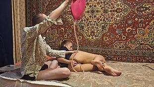 A guy gives a girl an enema at home