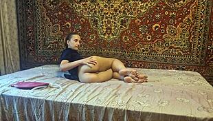 A guy gives a girl an enema at home